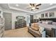 Relaxing main bedroom suite featuring a tray ceiling, ceiling fan, and an ensuite bath at 4571 Academy St, Acworth, GA 30101