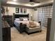 Well-decorated main bedroom featuring modern furniture, carpet, and attractive wall decor at 4571 Academy St, Acworth, GA 30101
