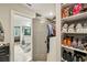 Walk-in closet with built in shelves and convenient access to the Primary bathroom at 4571 Academy St, Acworth, GA 30101