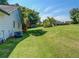 Expansive, well-maintained backyard with lush lawn and mature trees providing ample shade at 2321 Sunnyview Ln, Dacula, GA 30019