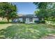 Back of the home, with access to a porch swing overlooking the spacious lawn at 2321 Sunnyview Ln, Dacula, GA 30019