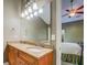 Bathroom featuring a double sink vanity with granite countertop, and access to the bedroom at 2321 Sunnyview Ln, Dacula, GA 30019