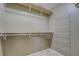 Walk-in closet with shelving and a rack for shoe storage, providing organization at 2321 Sunnyview Ln, Dacula, GA 30019