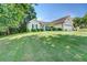 Charming ranch-style home with a well-kept lawn, mature trees, and a two-car garage at 2321 Sunnyview Ln, Dacula, GA 30019