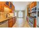 Modern kitchen featuring wood cabinets, stainless steel appliances, and granite countertops at 2321 Sunnyview Ln, Dacula, GA 30019