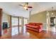 Spacious living room with hardwood floors, fireplace, and ample natural light at 2321 Sunnyview Ln, Dacula, GA 30019