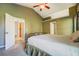 Main bedroom with ceiling fan, ensuite bathroom, and walk-in closet for convenience and comfort at 2321 Sunnyview Ln, Dacula, GA 30019