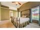 Large main bedroom with high ceilings, windows, and ensuite bathroom at 2321 Sunnyview Ln, Dacula, GA 30019