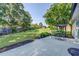 Spacious patio with an outdoor table and chairs, nestled in a beautifully landscaped backyard at 2321 Sunnyview Ln, Dacula, GA 30019