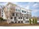 Modern condo building featuring private balconies, neutral brick, and manicured landscaping at 7230 Summit Pl, Alpharetta, GA 30009