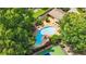 Aerial shot of community pool and tennis courts surrounded by mature trees at 12 Ivy Ne Rdg, Atlanta, GA 30342