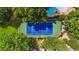 Aerial view showcasing the community tennis court and pool at 12 Ivy Ne Rdg, Atlanta, GA 30342