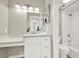 Bright bathroom with a vanity, a make-up counter, a subway tiled shower, and a toilet at 12 Ivy Ne Rdg, Atlanta, GA 30342