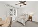 Bright bedroom featuring a cozy bed with soft linens and a view of the outside at 12 Ivy Ne Rdg, Atlanta, GA 30342