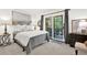 Cozy bedroom with sliding glass doors leading to a private outdoor space at 12 Ivy Ne Rdg, Atlanta, GA 30342
