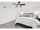 Carpeted bedroom with a ceiling fan, plush pillows, and a view of custom furniture at 12 Ivy Ne Rdg, Atlanta, GA 30342