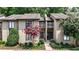 Charming townhome exterior featuring pink crape myrtle trees and lush landscaping at 12 Ivy Ne Rdg, Atlanta, GA 30342