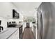Modern kitchen with white cabinets, stainless steel appliances, and stone countertops at 12 Ivy Ne Rdg, Atlanta, GA 30342
