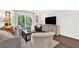Cozy living room with stylish furniture and a sliding glass door leading to outdoor seating at 12 Ivy Ne Rdg, Atlanta, GA 30342