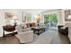 Comfortable living room with furniture and a sliding glass door offering access to the deck at 12 Ivy Ne Rdg, Atlanta, GA 30342
