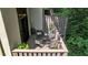 Secluded upper-level patio with outdoor dining set and views of the surrounding woods at 12 Ivy Ne Rdg, Atlanta, GA 30342