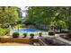 Enjoy a game of tennis on this well-maintained community court surrounded by mature trees at 12 Ivy Ne Rdg, Atlanta, GA 30342
