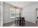 Cozy breakfast nook with a round table, barstools, and natural light from the window at 404 Arden, Ellenwood, GA 30294