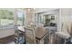 Dining room with bright natural light, wood floors, neutral paint, and wainscotting at 404 Arden, Ellenwood, GA 30294