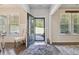 Bright foyer featuring hardwood floors, a view to the front yard, and natural light at 404 Arden, Ellenwood, GA 30294