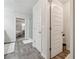 Hallway showing doors leading to the main bedroom, water closet and shower with hardwood floors at 404 Arden, Ellenwood, GA 30294