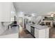 Bright, open kitchen with stainless steel appliances, large island, and seamless flow to the living area at 404 Arden, Ellenwood, GA 30294