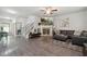 Open-concept living room featuring wood floors, a fireplace, and comfortable leather seating at 404 Arden, Ellenwood, GA 30294