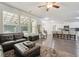 Open concept living room with wood floors that connect to the kitchen, offering a seamless flow at 404 Arden, Ellenwood, GA 30294