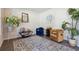 Cozy sitting area with hardwood floors, accent chairs, and tasteful decor at 404 Arden, Ellenwood, GA 30294