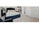 Main bedroom featuring a plush bed, mirrored side table, and ample natural light from the large window at 404 Arden, Ellenwood, GA 30294
