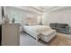 A serene primary bedroom boasts natural light, neutral tones, and a tray ceiling at 404 Arden, Ellenwood, GA 30294