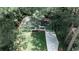 Beautiful aerial view of a charming home, surrounded by lush trees and a well-manicured lawn at 437 Valley Brook Ne Dr, Atlanta, GA 30342