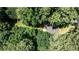 An eye-level aerial view of a home on a private lot with many mature trees at 437 Valley Brook Ne Dr, Atlanta, GA 30342