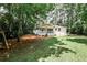 Charming backyard featuring a cozy porch and a well-maintained lawn, perfect for outdoor relaxation at 437 Valley Brook Ne Dr, Atlanta, GA 30342