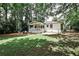 Large private backyard featuring a wooden porch and outdoor lounge area at 437 Valley Brook Ne Dr, Atlanta, GA 30342