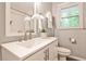 Bright bathroom with a white vanity, stylish fixtures, and natural light at 437 Valley Brook Ne Dr, Atlanta, GA 30342