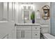 Stylish bathroom with a walk-in shower, floating shelves, and neutral color palette at 437 Valley Brook Ne Dr, Atlanta, GA 30342