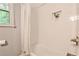 Stylish bathroom with a bright white subway tiled shower and built-in niche at 437 Valley Brook Ne Dr, Atlanta, GA 30342