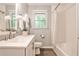 Bright bathroom featuring a bathtub with white subway tile and window at 437 Valley Brook Ne Dr, Atlanta, GA 30342
