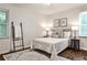 Comfortable bedroom with hardwood floors, a cozy rug, and tasteful decor at 437 Valley Brook Ne Dr, Atlanta, GA 30342