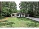 Charming one-story home with freshly painted white brick and a well-manicured lawn at 437 Valley Brook Ne Dr, Atlanta, GA 30342