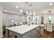 Bright open-concept kitchen with a large island and seamless flow into the living space at 437 Valley Brook Ne Dr, Atlanta, GA 30342