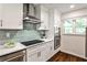 Kitchen featuring stainless appliances, granite countertops and tile backsplash at 437 Valley Brook Ne Dr, Atlanta, GA 30342
