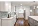 Kitchen features stainless appliances, white cabinets and granite countertops at 437 Valley Brook Ne Dr, Atlanta, GA 30342