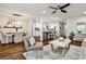 Open-concept living area with a modern kitchen, bright ambiance, and stylish furniture arrangement at 437 Valley Brook Ne Dr, Atlanta, GA 30342